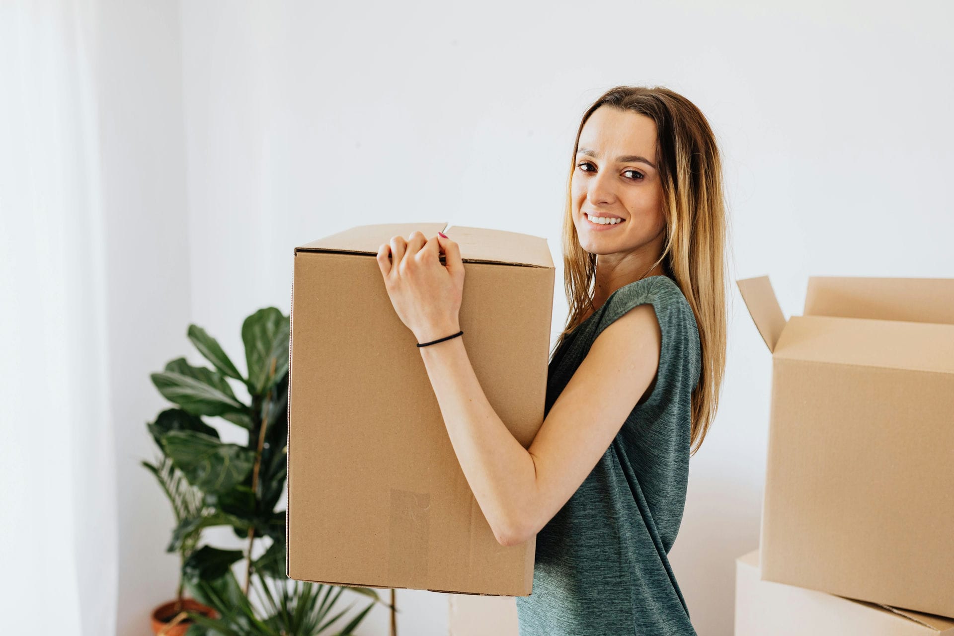 Woman moving a box